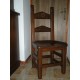Sedia fondo in legno tondeggiato e intagliato